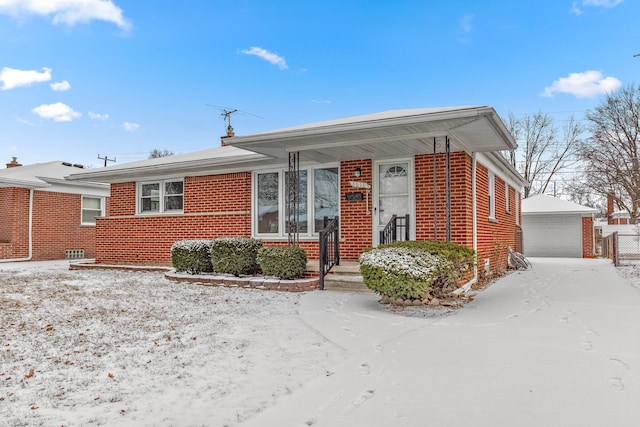 view of front of house featuring a garage and an outdoor structure