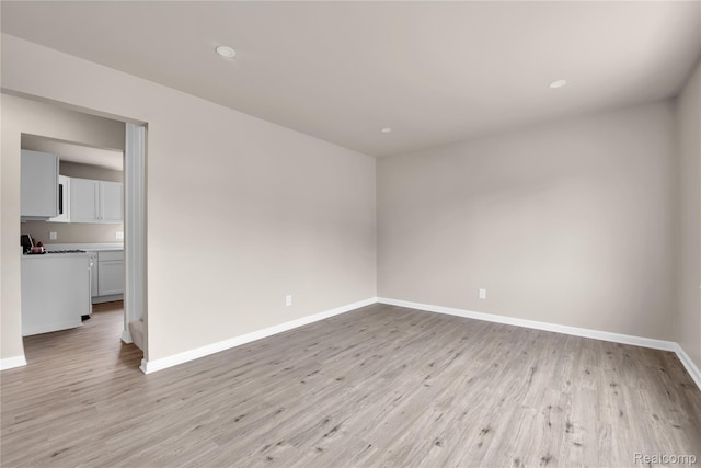 23225 Beverly St, Saint Clair Shores, MI 48082 - spare room featuring light wood-style floors, baseboards, and recessed lighting