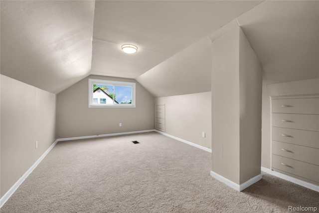 23225 Beverly St, Saint Clair Shores, MI 48082 - additional living space featuring carpet, vaulted ceiling, and baseboards