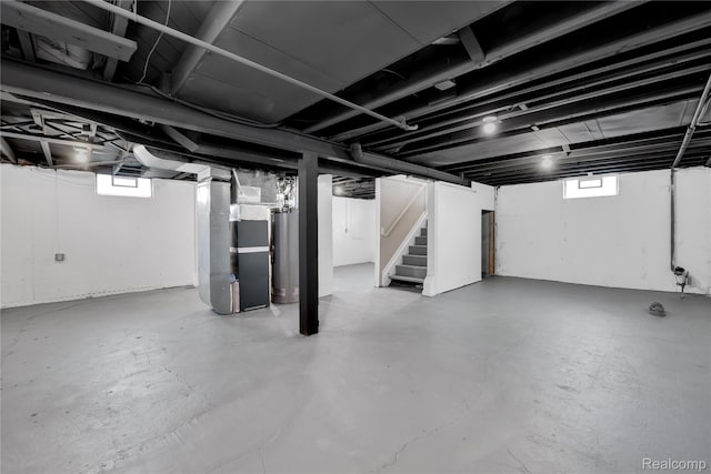 23225 Beverly St, Saint Clair Shores, MI 48082 - basement featuring stairs, heating unit, and water heater