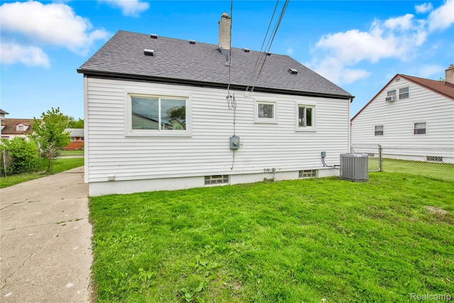 23225 Beverly St, Saint Clair Shores, MI 48082 - rear view of property with central air condition unit, a chimney, and a shingled roof
