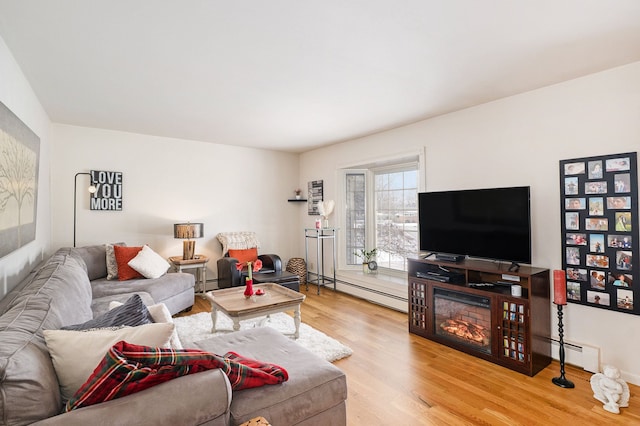 living room featuring hardwood / wood-style flooring and a baseboard radiator