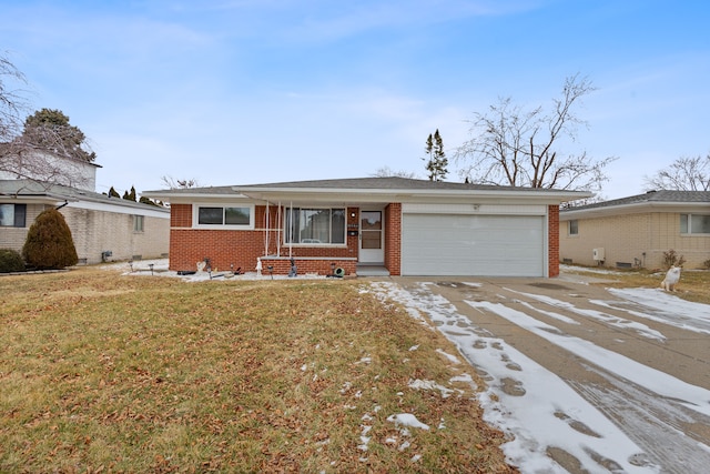 single story home with a garage and a front lawn