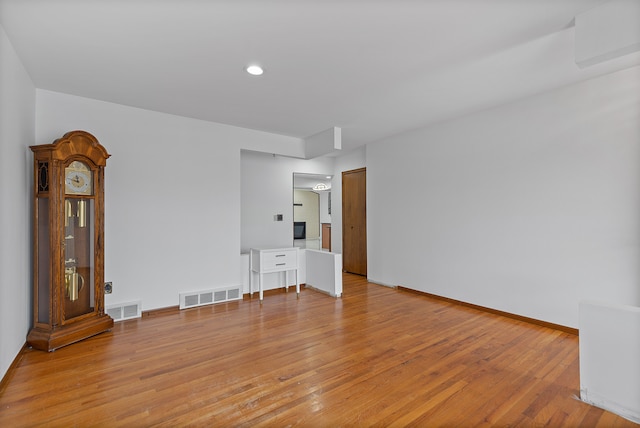 spare room with light hardwood / wood-style flooring