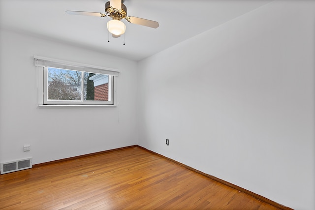 unfurnished room featuring light hardwood / wood-style flooring and ceiling fan