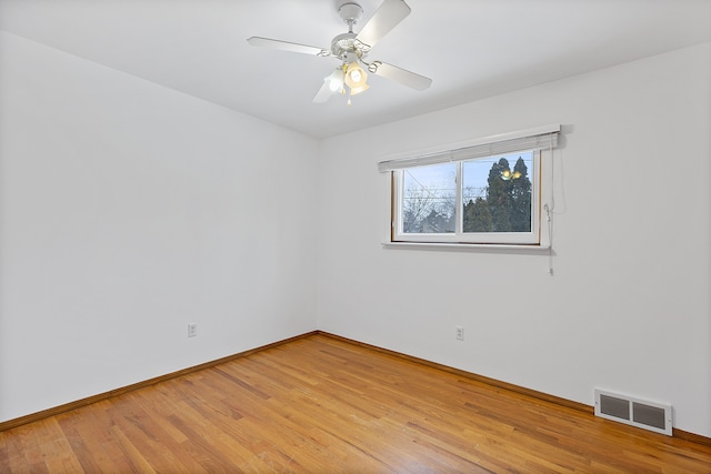 empty room with light hardwood / wood-style floors and ceiling fan