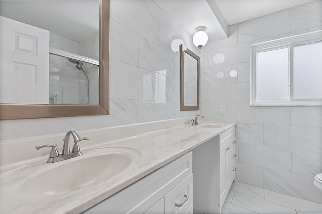 bathroom with vanity, tile walls, an enclosed shower, and toilet