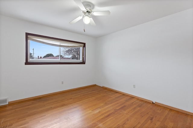 unfurnished room with hardwood / wood-style floors and ceiling fan