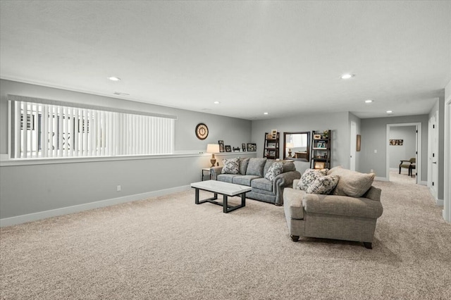 living room featuring recessed lighting, light colored carpet, and baseboards