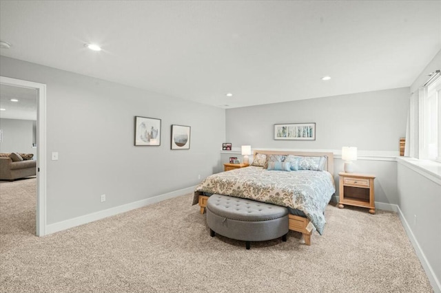 carpeted bedroom featuring baseboards and recessed lighting