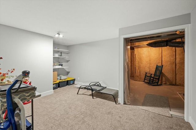 interior space featuring carpet and baseboards