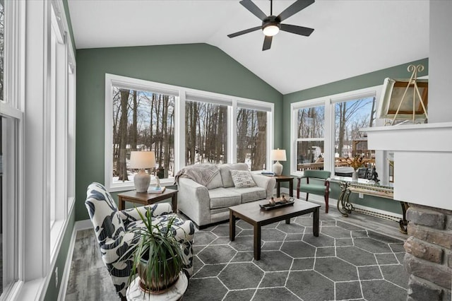 sunroom / solarium featuring vaulted ceiling and a ceiling fan