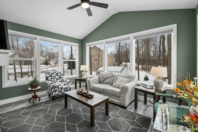 sunroom with vaulted ceiling and a ceiling fan