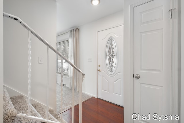 foyer with dark hardwood / wood-style floors