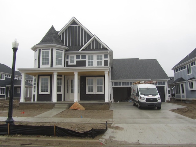 view of front of property with a garage and covered porch