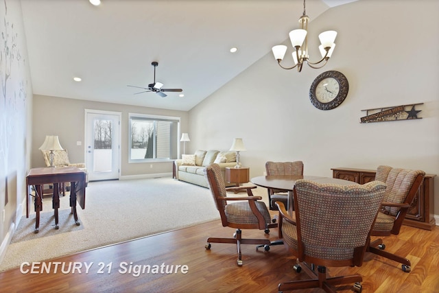 100 Tuscany Cir, Saginaw, MI 48603 - dining area featuring vaulted ceiling, a chandelier, light wood-type flooring, a ceiling fan, and baseboards