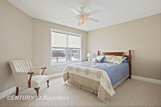 100 Tuscany Cir, Saginaw, MI 48603 - bedroom with baseboards, light carpet, and ceiling fan