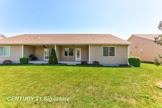 100 Tuscany Cir, Saginaw, MI 48603 - rear view of house with ceiling fan, a lawn, and a patio