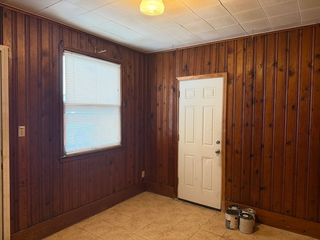 interior space featuring wood walls