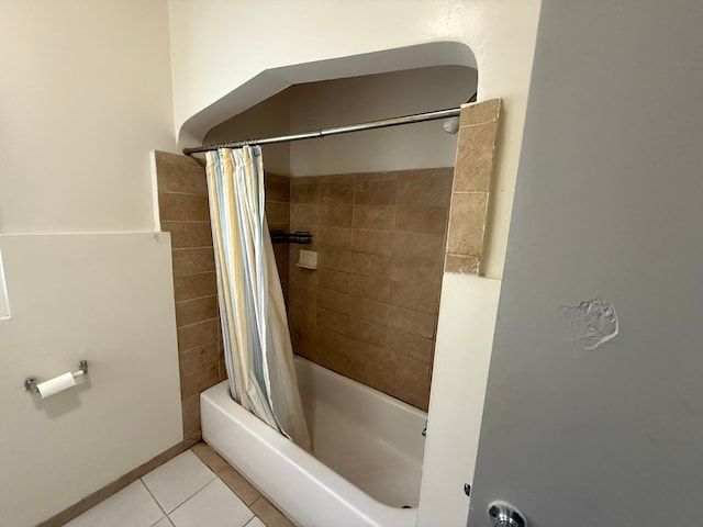 full bath with shower / tub combo and tile patterned floors