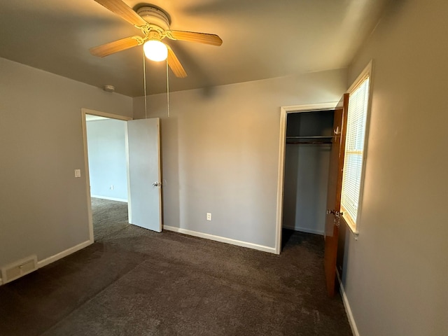 5727 Merriman Rd, Garden City, MI 48135 - unfurnished bedroom with dark colored carpet, baseboards, a closet, and ceiling fan