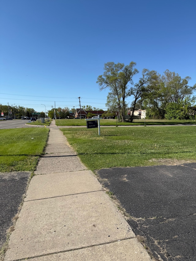 5727 Merriman Rd, Garden City, MI 48135 - view of asphalt road with sidewalks and street lighting