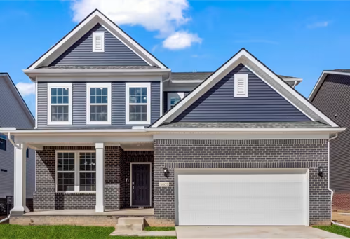 view of front of house with a garage and a porch