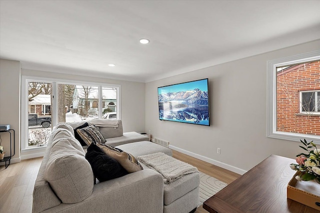 living room with light hardwood / wood-style floors