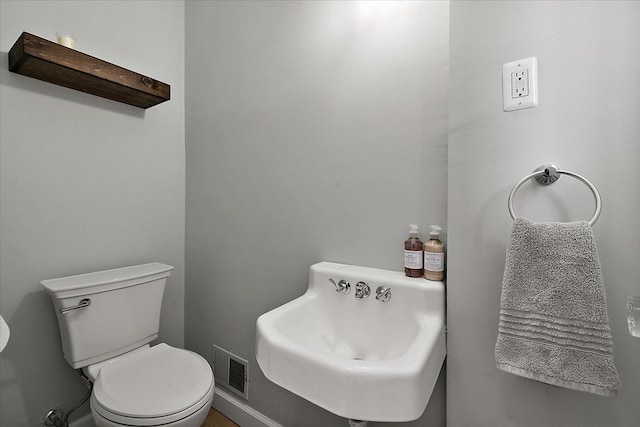 bathroom featuring sink and toilet