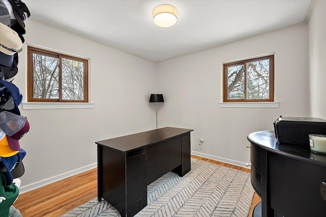 office with light hardwood / wood-style flooring