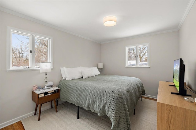 bedroom with hardwood / wood-style floors and crown molding