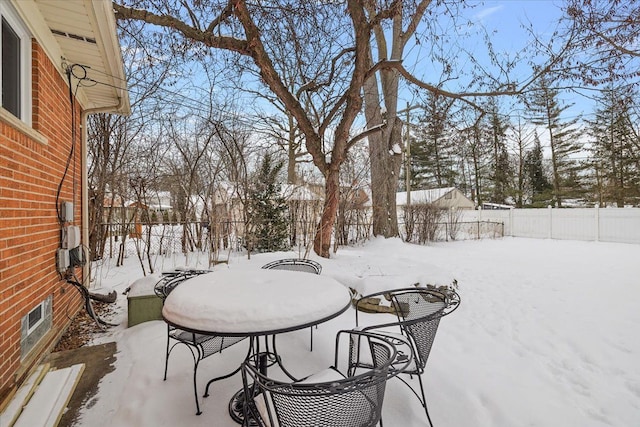 view of yard layered in snow