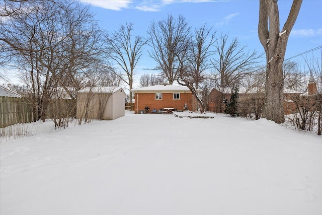 view of yard covered in snow