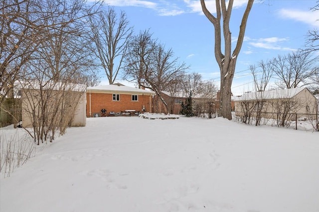 view of yard covered in snow