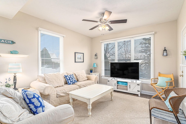 living room with hardwood / wood-style flooring, plenty of natural light, and ceiling fan