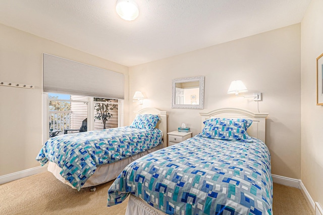 carpeted bedroom featuring a textured ceiling