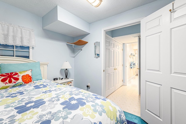 bedroom featuring a textured ceiling