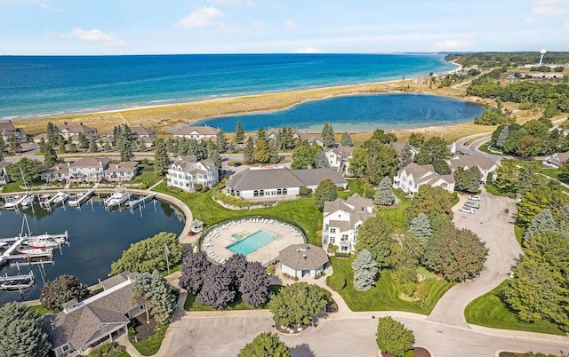 bird's eye view with a water view and a view of the beach