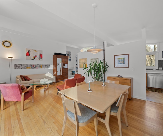 dining space with light wood-type flooring