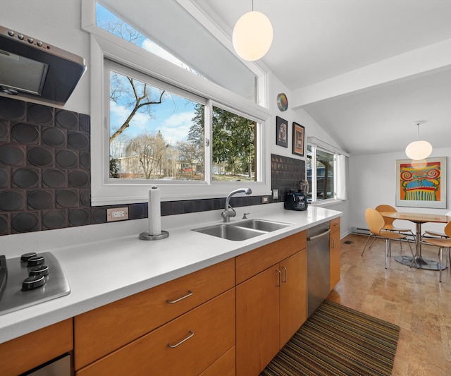 kitchen with extractor fan, sink, stainless steel dishwasher, electric stovetop, and pendant lighting