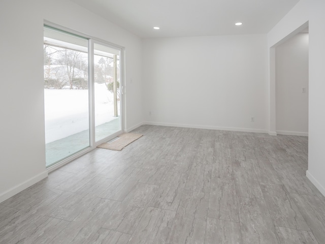 empty room with light hardwood / wood-style floors