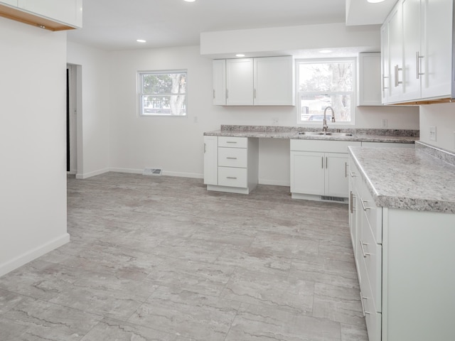 kitchen with sink and white cabinets