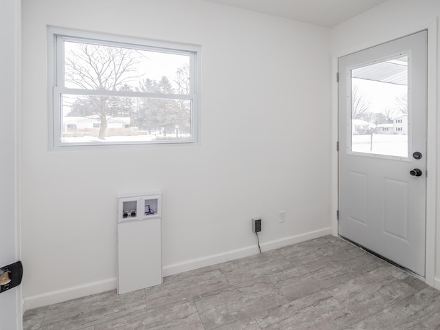 laundry area featuring a healthy amount of sunlight and washer hookup