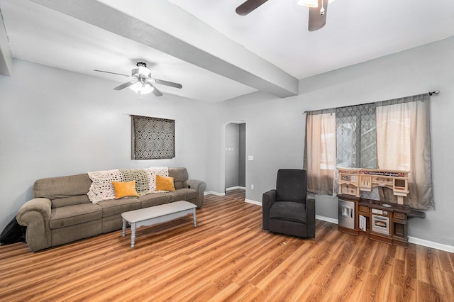 living room with hardwood / wood-style flooring and ceiling fan