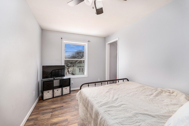 bedroom with dark wood-type flooring and ceiling fan