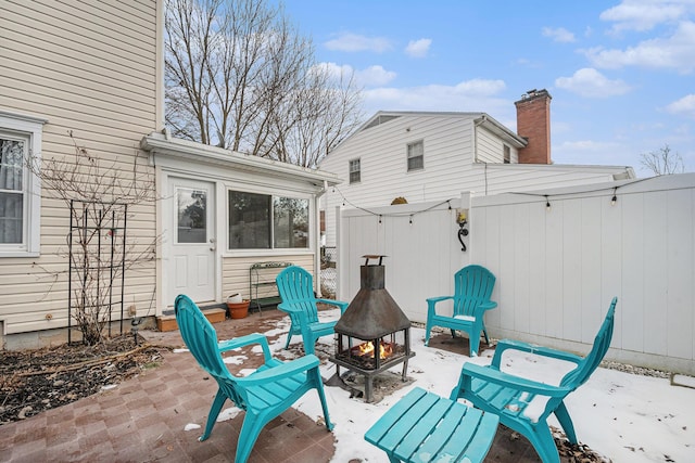 view of patio / terrace featuring a fire pit