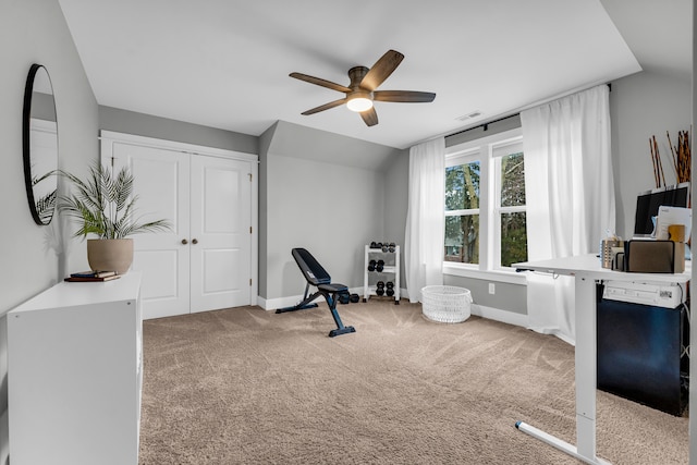 workout area featuring carpet floors, visible vents, vaulted ceiling, ceiling fan, and baseboards