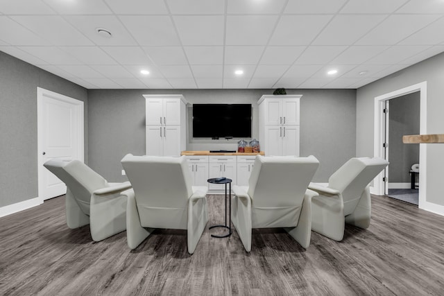 bar featuring recessed lighting, wood finished floors, a paneled ceiling, and baseboards