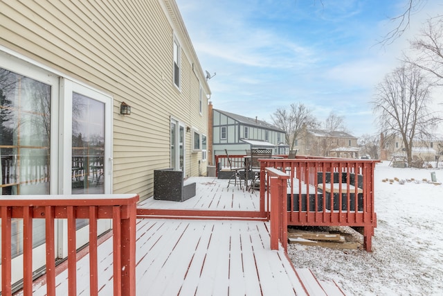 view of snow covered deck