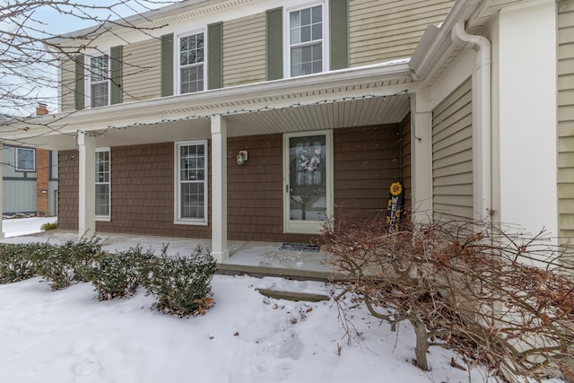 view of snow covered property entrance